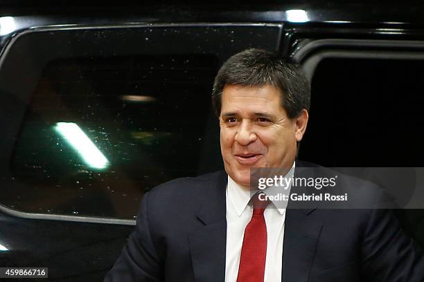 Horacio Cartes President of Paraguay arrives before the Official Draw of 56th Copa Bridgestone Libertadores at Conmebol Convention Center on December...