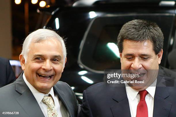 Horacio Cartes President of Paraguay arrives before the Official Draw of 56th Copa Bridgestone Libertadores at Conmebol Convention Center on December...