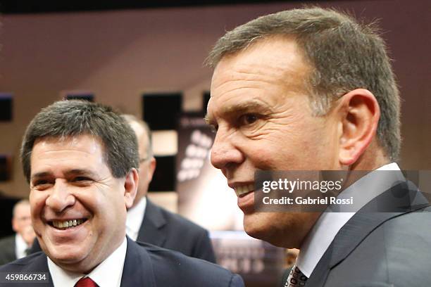 Horacio Cartes President of Paraguay speaks to Juan Angel Napout President of Conmebol before the Copa Bridgestone Libertadores 2015 official draw at...