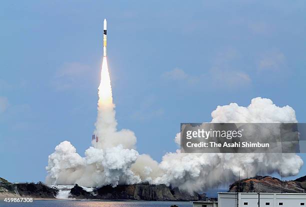 The H-2A Launch Vehicle No. 26 carrying Hayabusa 2, a robotic spacecraft of Japan Aerospace Exploration Agency lifts off from the launch pad at the...