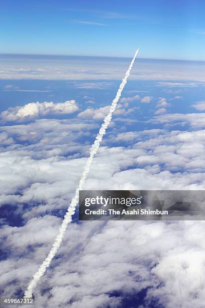 The H-2A Launch Vehicle No. 26 carrying Hayabusa 2, a robotic spacecraft of Japan Aerospace Exploration Agency lifts off from the launch pad at the...