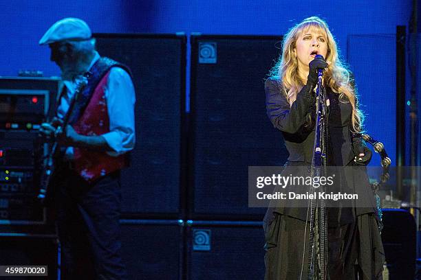 Vocalist Stevie Nicks and bassist John McVie of Fleetwood Mac perform on stage at Viejas Arena on December 2, 2014 in San Diego, California.