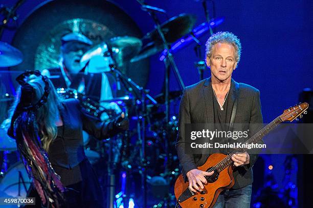 Vocalist Stevie Nicks, drummer Mick Fleetwood and guitarist/vocalist Lindsey Buckingham of Fleetwood Mac perform on stage at Viejas Arena on December...