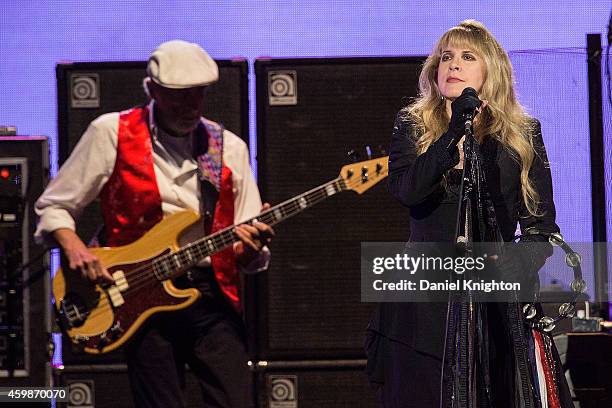 Vocalist Stevie Nicks and bassist John McVie of Fleetwood Mac perform on stage at Viejas Arena on December 2, 2014 in San Diego, California.