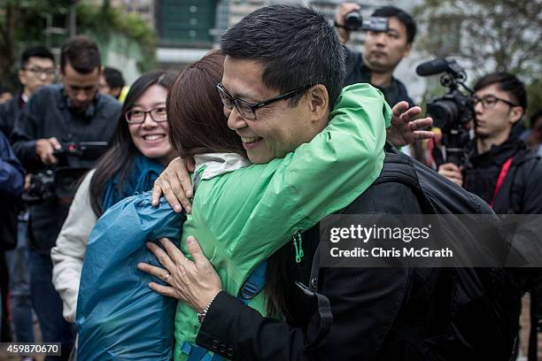 Chan Kin-man, one of the original pro-democracy Occupy Central founders hugs a supporter after surrendering to police on December 3, 2014 in Hong...