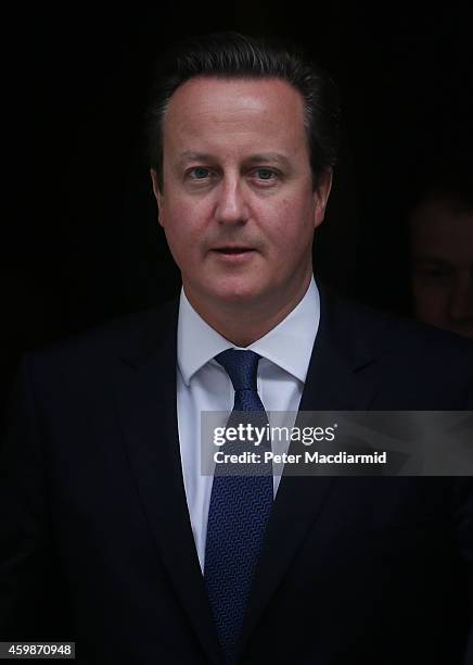 Prime Minister David Cameron leaves Downing Street for Parliament on December 3, 2014 in London, England. Chancellor of the Exchequer George Osborne...