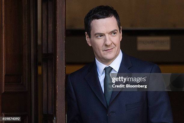 George Osborne, U.K. Chancellor of the exchequer, leaves the HM Treasury building before heading to the Houses of Parliament to deliver his Autumn...