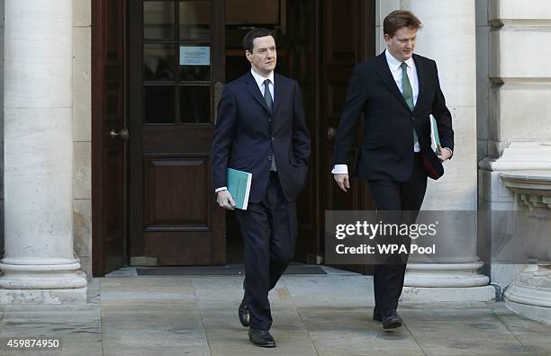 Chancellor George Osborne and Chief Secretary of the Treasury Danny Alexander leave The Treasury for Parliament on December 3, 2014 in London,...