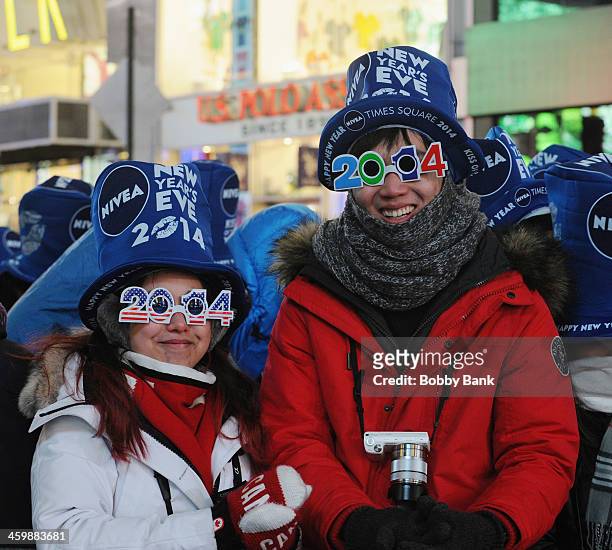 New Year's Eve revelers ring in 2014 at the New Year's Eve 2014 in Times Square on December 31, 2013 in New York City.