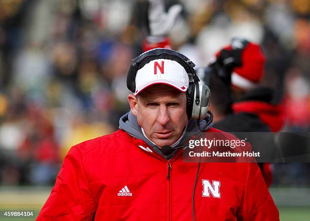 Head coach Bo Pelini of the Nebraska Cornhuskers walks the sidelines during the second half against the Iowa Hawkeyes, on November 28, 2014 at...