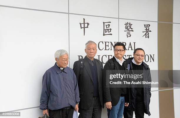 Pro-democracy activists Benny Tai, Joseph Zen, Chu Yiu-ming and Chan Kin-man surrender themselves in to the police on December 3, 2014 in Hong Kong....