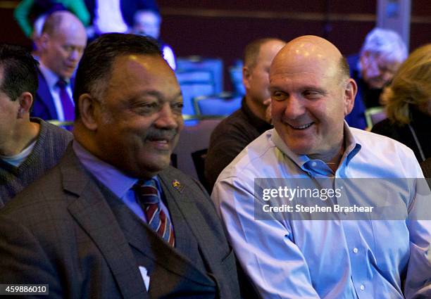 Former Microsoft CEO Steve Ballmer, right, and Reverend Jesse Jackson share a laugh before the Microsoft Shareholders Meeting December 3, 2014 in...