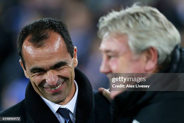 Roberto Martinez the manager of Everton and Steve Bruce the manager of Hull City greet each other prior to kickoff during the Barclays Premier League...