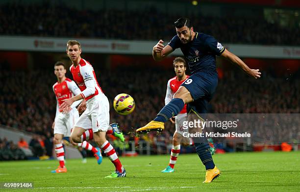 Graziano Pelle of Southampton shoots at goal during the Barclays Premier League match between Arsenal and Southampton at Emirates Stadium on December...