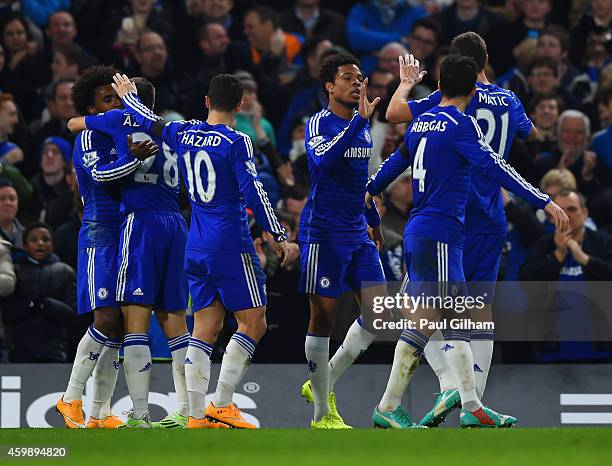 Loic Remy of Chelsea celebrates scoring their third goal with Cesc Fabregas, Eden Hazard and Cesar Azpilicueta of Chelsea during the Barclays Premier...