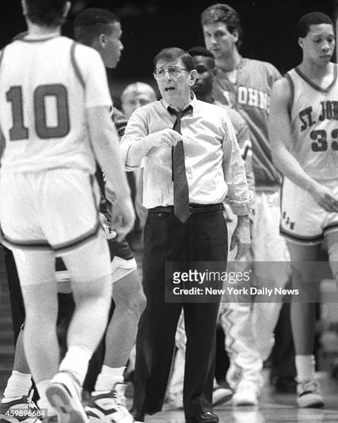 St. John's coach Lou Carnesecca tries to rally troops in Big East Tournament's 8-9 game vs. Boston College last night at Garden. But Dana Barros...