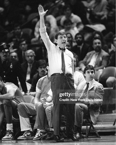 Lou Carnesecca, St. John's head basketball coach and head cheerleader, gives it the old college try on sidelines of Madison Square Garden as his...