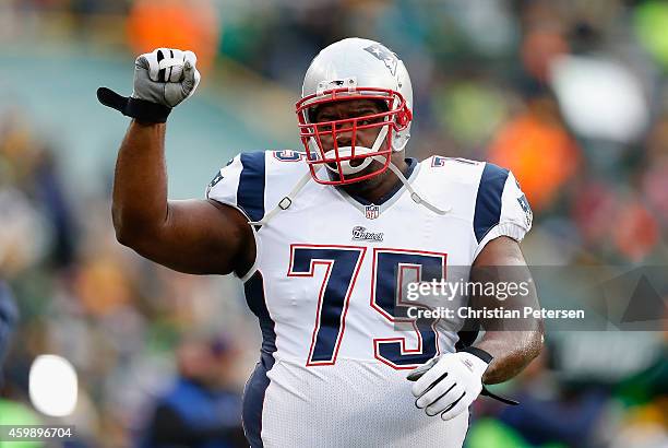 Defensive tackle Vince Wilfork of the New England Patriots warms up before the NFL game against the Green Bay Packers at Lambeau Field on November...