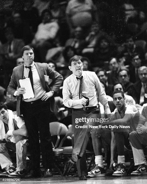 Lou Carnesecca, St. John's head basketball coach and head cheerleader, gives it the old college try on sidelines of Madison Square Garden as his...