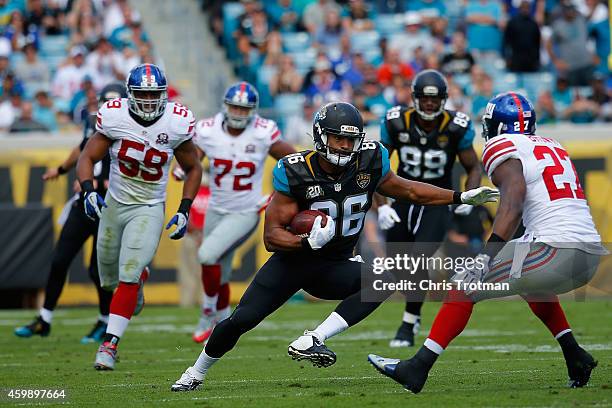 Tommie Campbell of the Jacksonville Jaguars runs with the ball against the New York Giants at EverBank Field on November 30, 2014 in Jacksonville,...