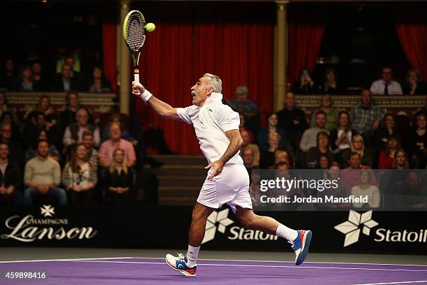 Mansour Bahrami plays a trick shot during the Mens Doubles match between Mansour Bahrami and Andrew Castle against Pat Cash and Peter McNamara on day...