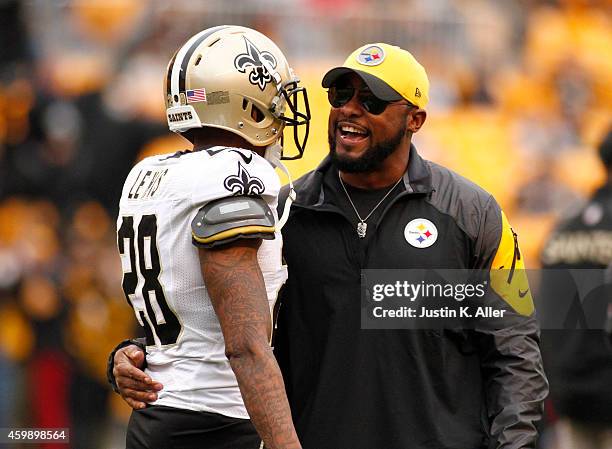 Head coach Mike Tomlin of the Pittsburgh Steelers hugs Keenan Lewis of the New Orleans Saints before the game on November 30, 2014 at Heinz Field in...