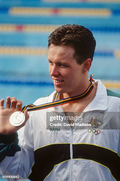 Kieren Perkins of Australia shows off his silver medal for the Men's 400 meter freestyle event of the swimming competition of the 1992 Summer...