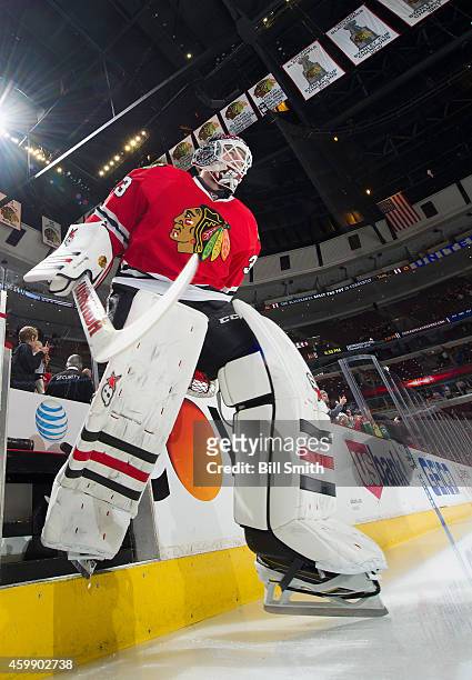 Goalie Scott Darling of the Chicago Blackhawks steps out to the ice prior to the NHL game against the St. Louis Blues at the United Center on...