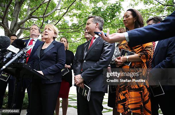 Opposition leader Bill Shorten and his colleagues speak to the media during a press conference to reflect on 'Tony Abbott's Year of Broken Promises'...