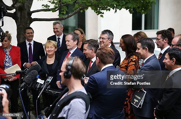 Opposition leader Bill Shorten and his colleagues speak to the media during a press conference to reflect on 'Tony Abbott's Year of Broken Promises'...