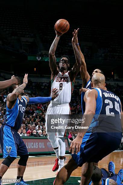 Larry Sanders of the Milwaukee Bucks shoots against the Dallas Mavericks on December 3, 2014 at the BMO Harris Bradley Center in Milwaukee,...