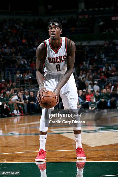 Larry Sanders of the Milwaukee Bucks attempts a free throw against the Dallas Mavericks on December 3, 2014 at the BMO Harris Bradley Center in...