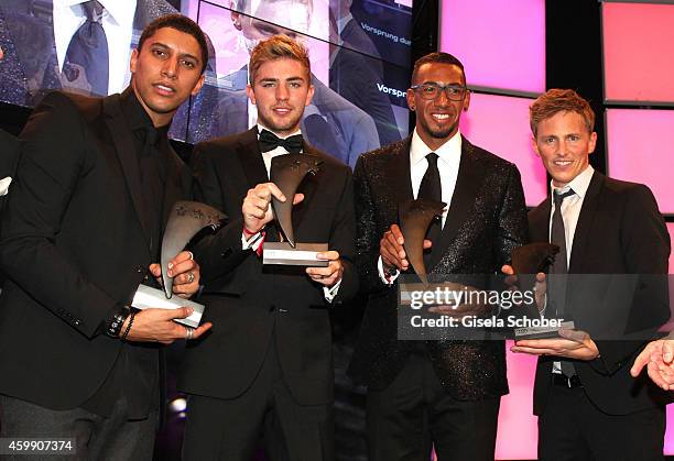 Andreas Bourani, Christoph Kramer, Jerome Boateng, Jochen Breyer with award during the Audi Generation Award 2014 at Hotel Bayerischer Hof on...