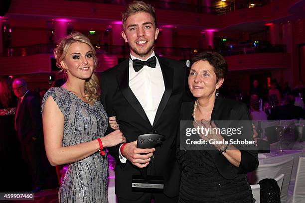 Christoph Kramer and his girlfriend Celina Scheufele and his mother Gabi during the Audi Generation Award 2014 at Hotel Bayerischer Hof on December...