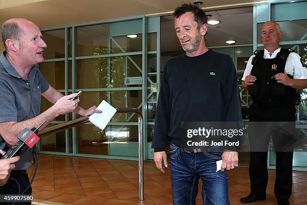 Drummer Phil Rudd speaks to reporters as he leaves Tauranga District Court after being arrested in relation to breach of bail conditions on December...