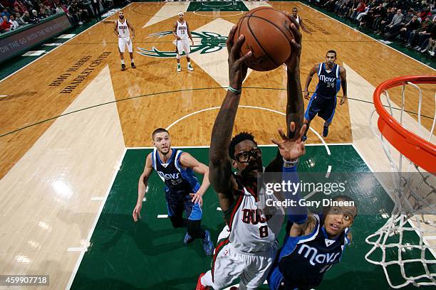 Larry Sanders of the Milwaukee Bucks dunks against the Dallas Mavericks on December 3, 2014 at the BMO Harris Bradley Center in Milwaukee, Wisconsin....