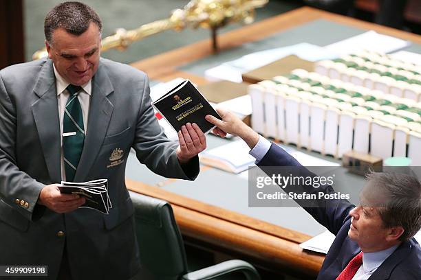 Opposition Leader Bill Shorten is forced to hand in his prop 'Tony Abbott's year of broken promises' during House of Representatives question time at...