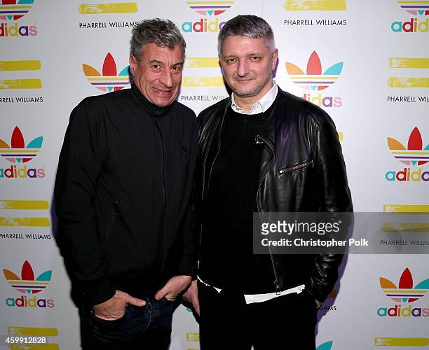 Artist Maurizio Cattelan and Adidas creative director Dirk Schonberger attend the collaboration celebration of Pharrell Williams and Adidas at Hinoki...