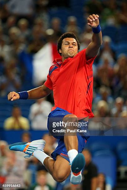 Jo-Wilfried Tsonga of France celebrates defeating John Isner of the United States in the men's singles match during day five of the Hopman Cup at...