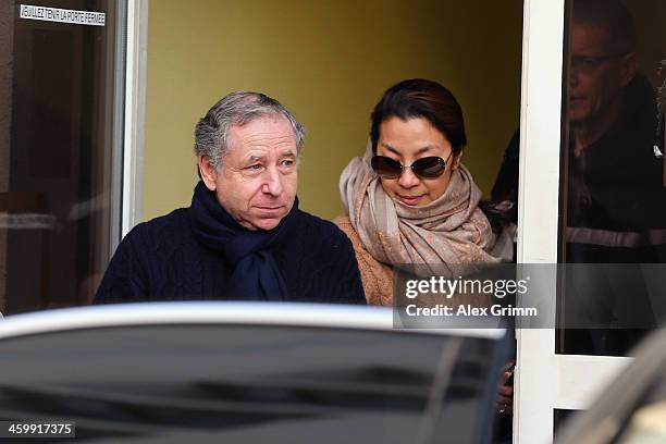 President Jean Todt and his wife actress Michelle Yeoh leave the Grenoble University Hospital Centre where former German Formula One driver Michael...