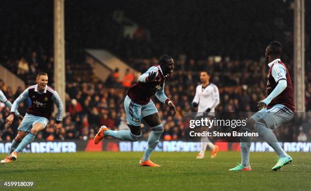 Mohamed Diame of West Ham celebrates after scoring the opening goal during the Barclays Premier League match between Fulham and West Ham United at...