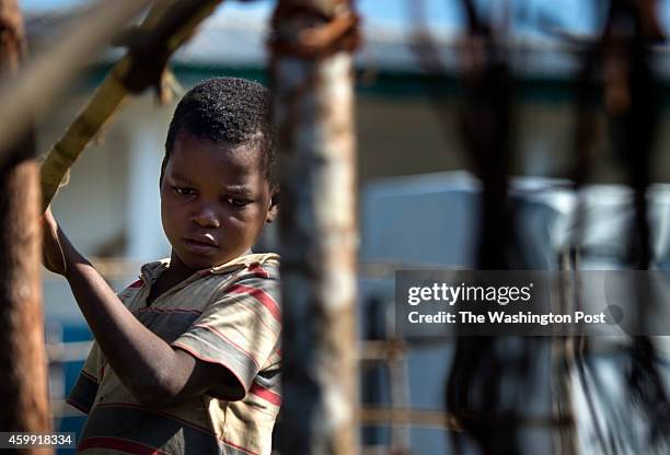 Foday Kalma whose mother died of the Ebola virus, is quarantined in the remote village of Kumala, Sierra Leone, on Friday, November 21, 2014. Ebola...