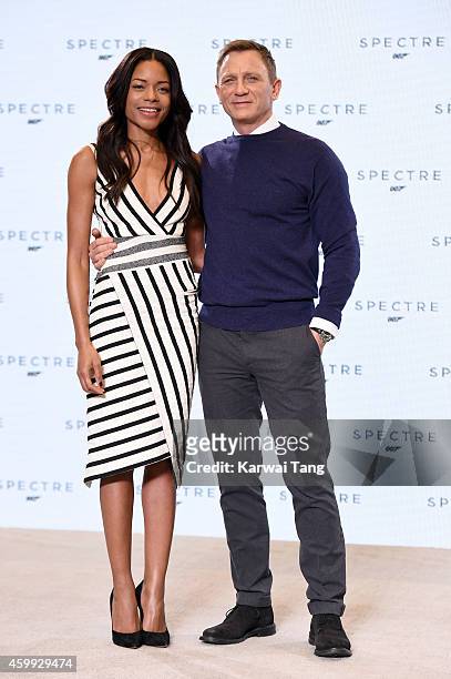 Naomie Harris and Daniel Craig attend the photocall to announce the start of the production of the 24th Bond Film 'Spectre' at Pinewood Studios on...