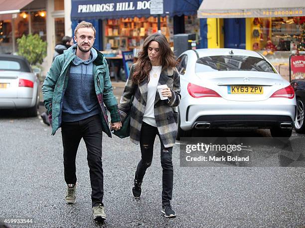 Tom Felton and partner Jade Olivia spotted in Primrose Hill, north London with his Mercedes-Benz CLA 45 AMG on December 4, 2014 in London, England.