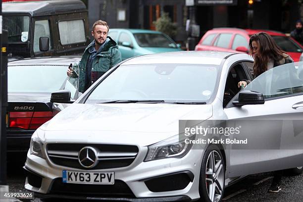 Tom Felton and partner Jade Olivia spotted in Primrose Hill, north London with his Mercedes-Benz CLA 45 AMG on December 4, 2014 in London, England.