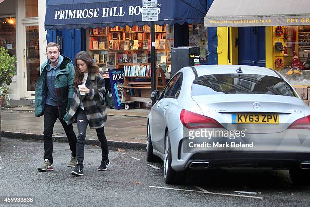 Tom Felton and partner Jade Olivia spotted in Primrose Hill, north London with his Mercedes-Benz CLA 45 AMG on December 4, 2014 in London, England.
