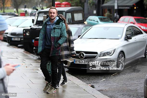 Tom Felton and partner Jade Olivia spotted in Primrose Hill, north London with his Mercedes-Benz CLA 45 AMG on December 4, 2014 in London, England.