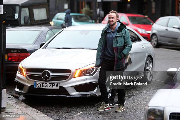 Tom Felton and partner Jade Olivia spotted in Primrose Hill, north London with his Mercedes-Benz CLA 45 AMG on December 4, 2014 in London, England.