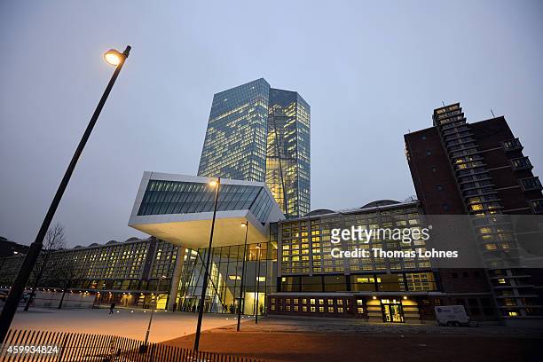 General view to the new headquarters of the European Central Bank and the skyscraper pictured in the twilight on December 4, 2014 in Frankfurt am...