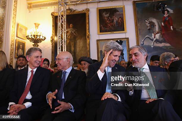 Secretary of State John Kerry speaks with Abdullah Abdullah, Chief Executive Officer of Afghanistan during the London Conference on Afghanistan on...